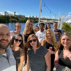 Group of many professional AMA volunteers at a regional retreat on a river boat